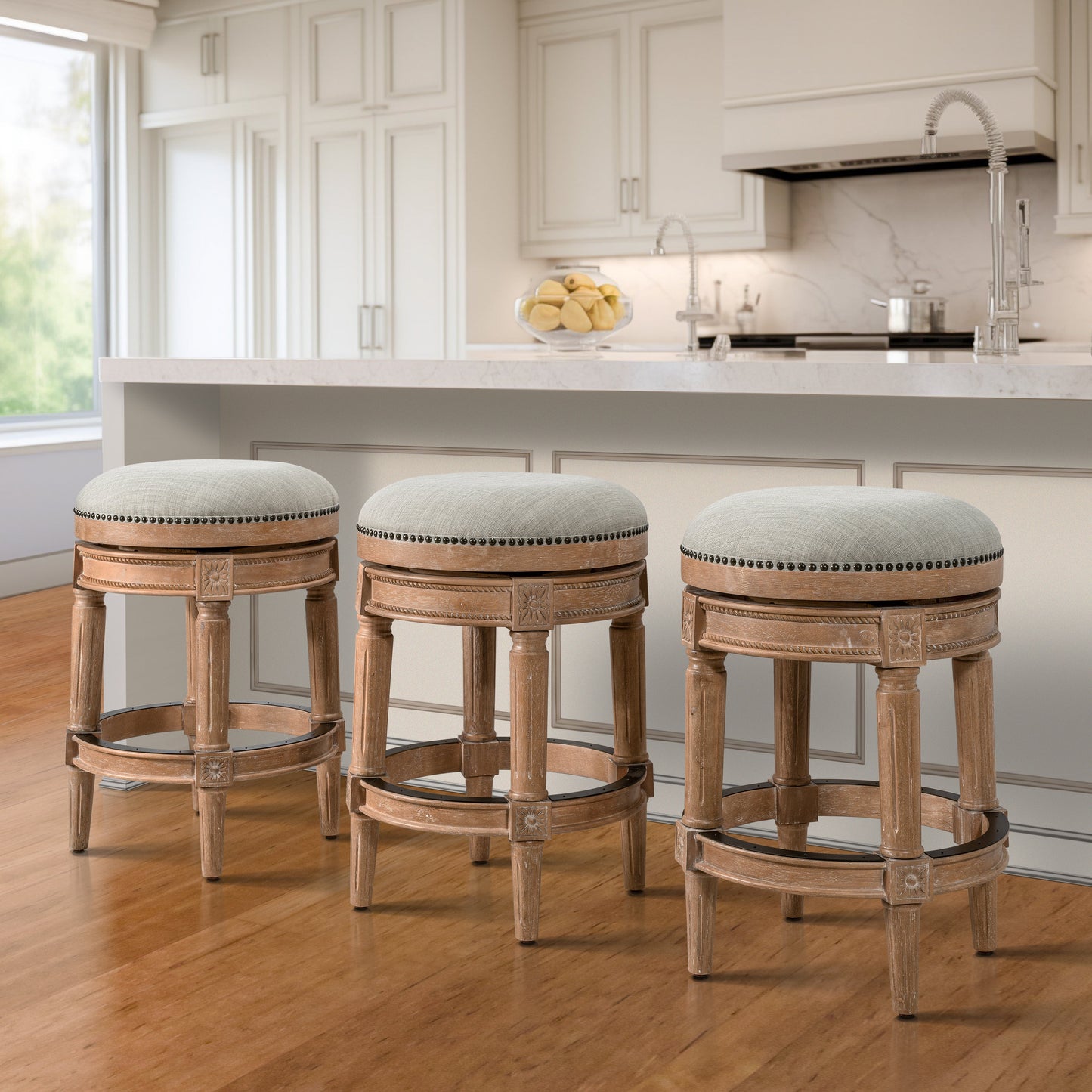 Backless Charlotte Barstool in Oak with plush seat and hand-crafted turned legs, perfect for kitchen islands.