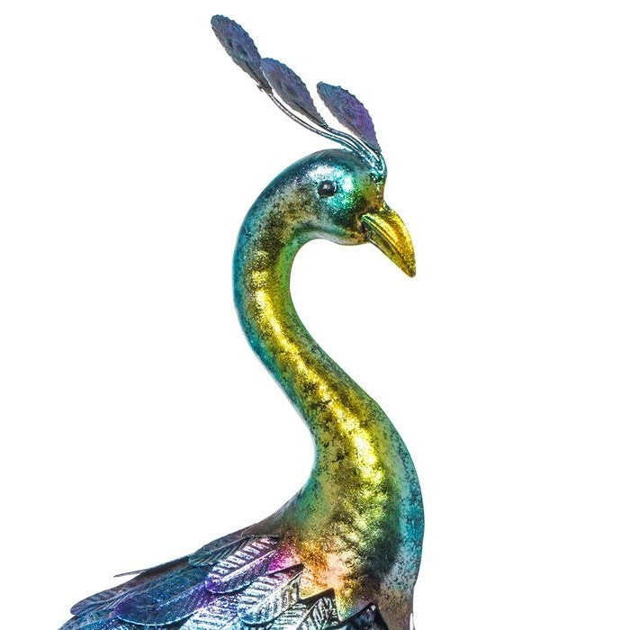 Colorful peacock figurine on a white background