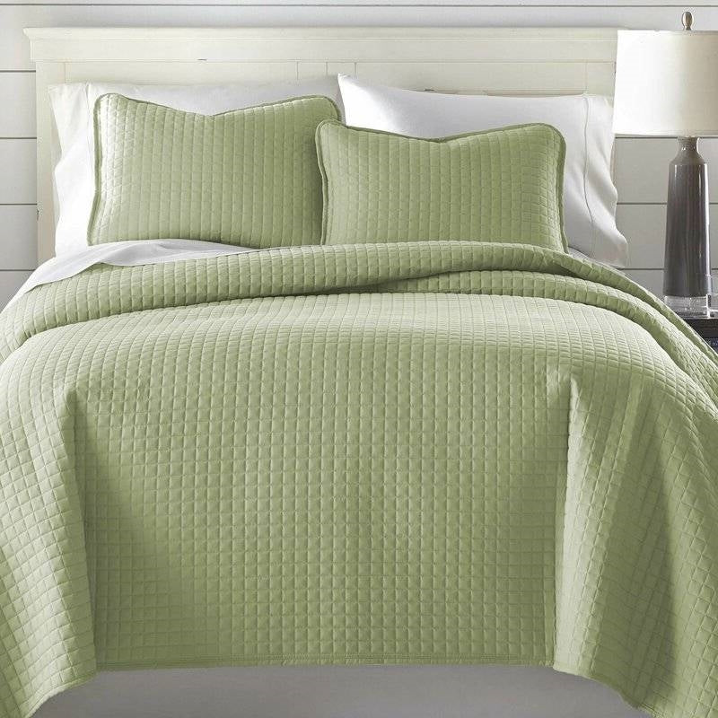 Full Queen Lightweight Sage Ultra Soft 3-Piece Microfiber Quilt Set displayed on a bed with matching pillows.