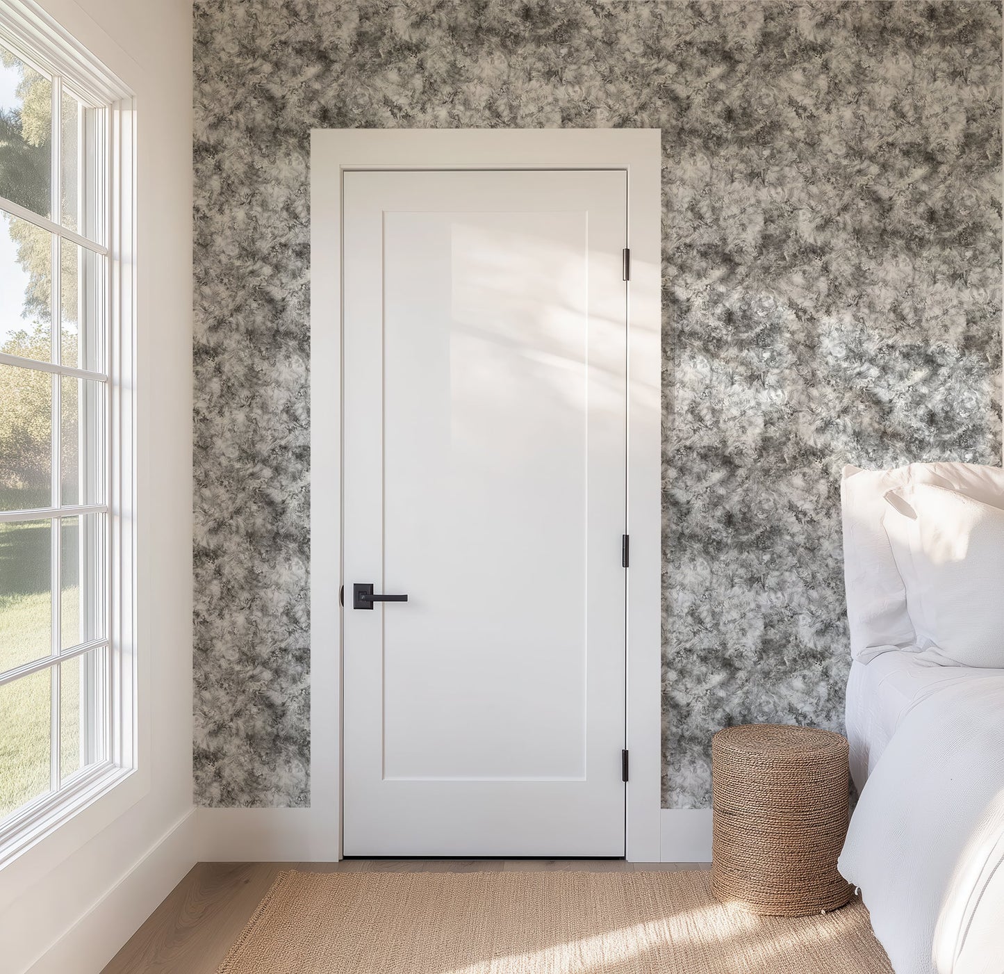 Subtle Marble Wallpaper in Modern Mineral Tones featured on a bedroom wall with a white door.