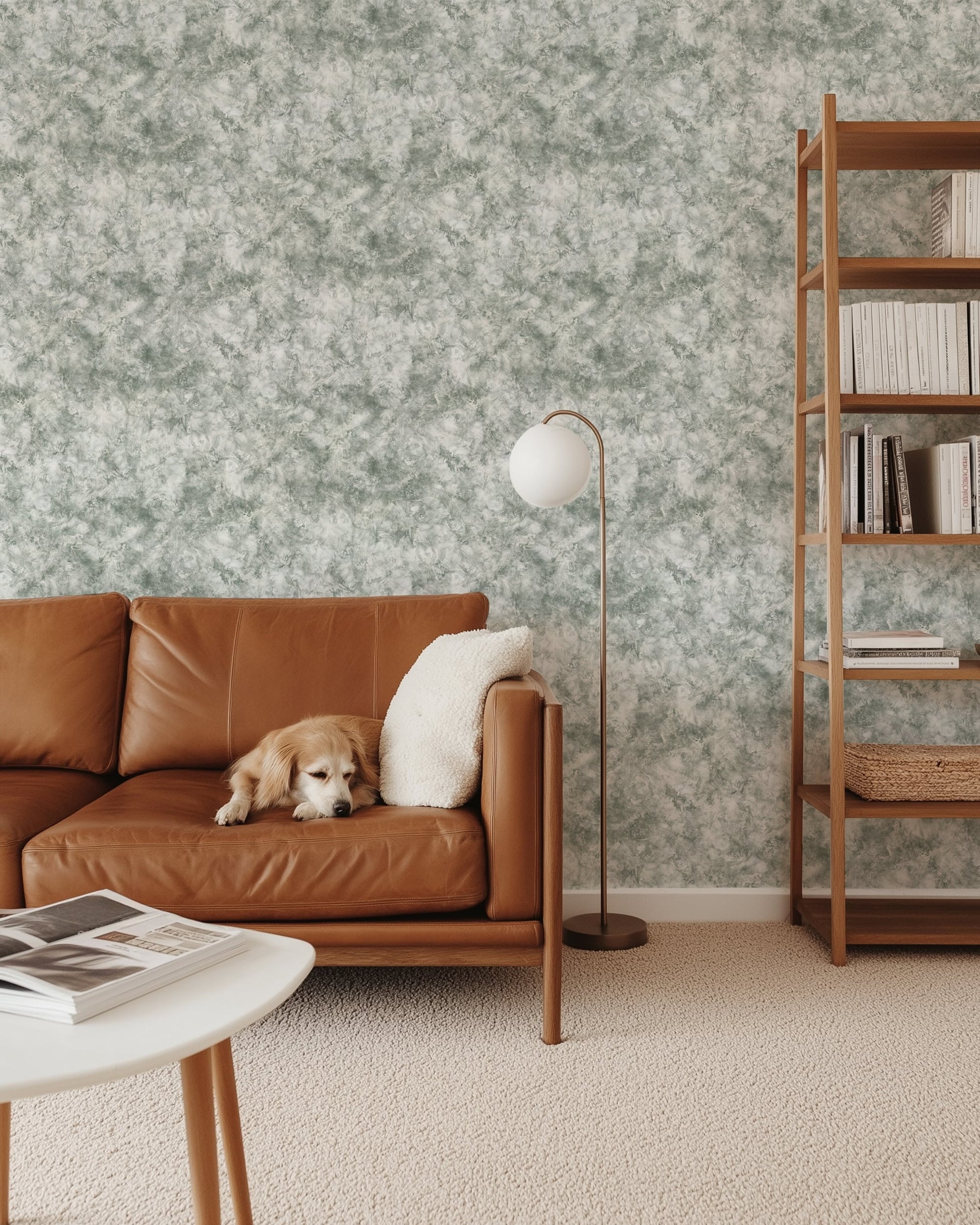 Cozy living room featuring Subtle Marble Wallpaper in Modern Mineral Tones with a dog on a brown leather sofa.
