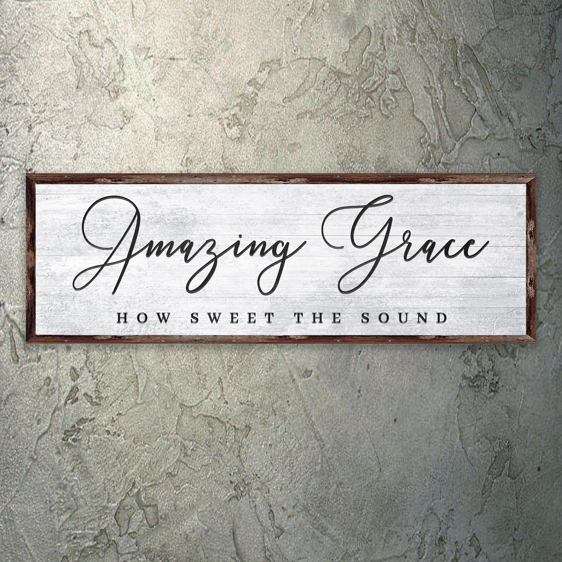 Decorative sign with 'Amazing Grace' text on a textured wall.
