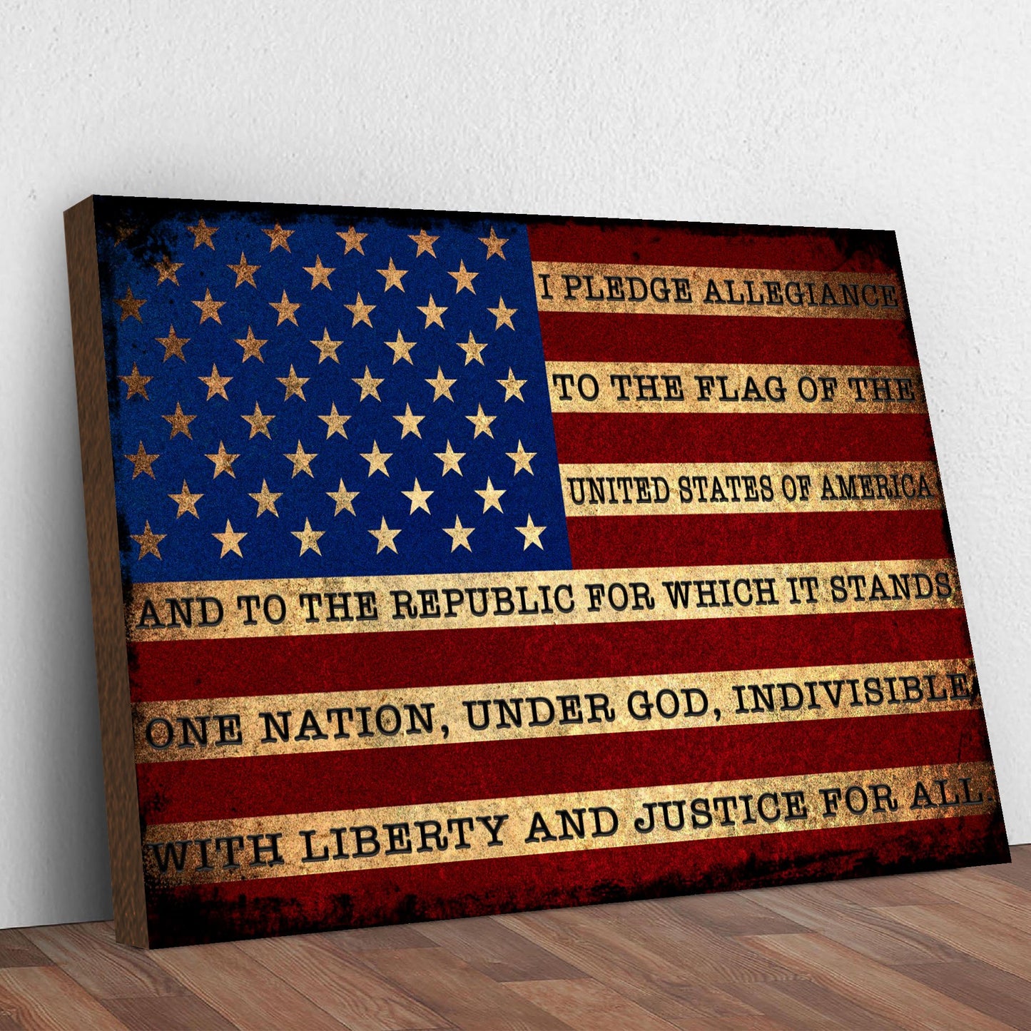 American flag with Pledge of Allegiance text on a wooden surface