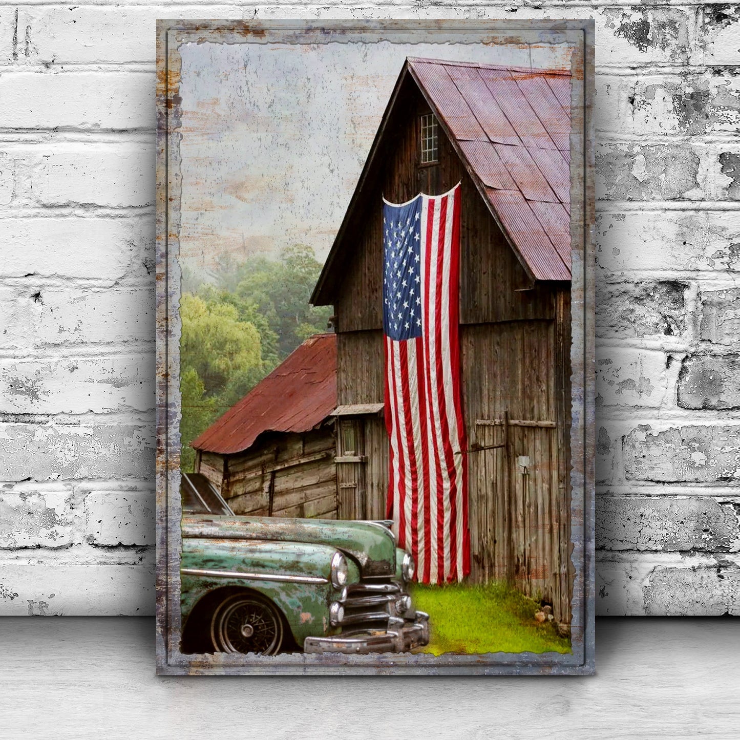 Framed artwork of a vintage car in front of a wooden building with an American flag.