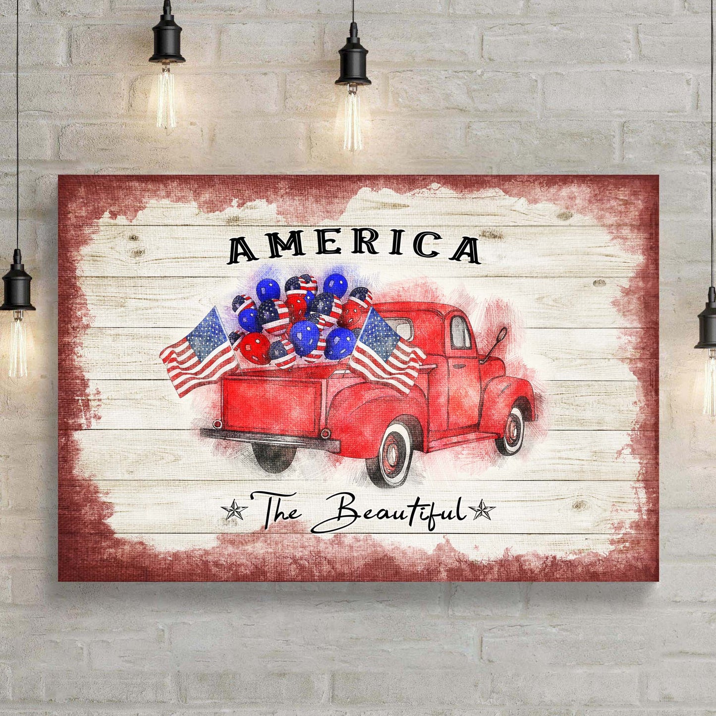 Decorative wall art with a red truck, American flags, and balloons on a wooden background.