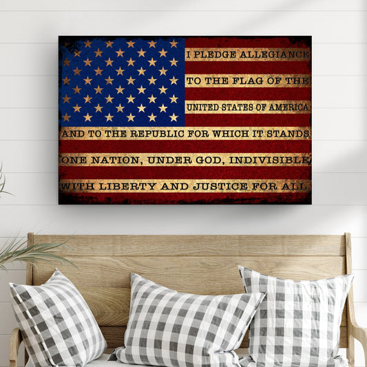 American flag with the Pledge of Allegiance on a wall above a wooden bench with checkered pillows.