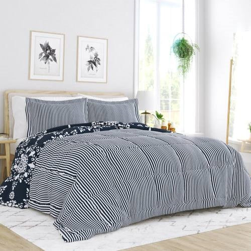Twin 3-Piece Navy Blue White Reversible Floral Striped Comforter Set displayed in a bright bedroom setting.