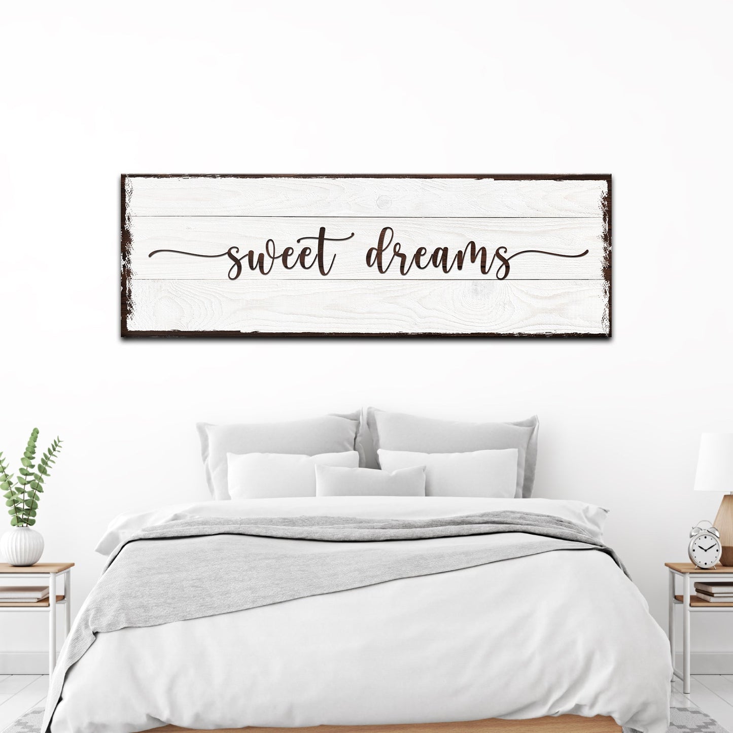 Bedroom with 'sweet dreams' sign above the bed