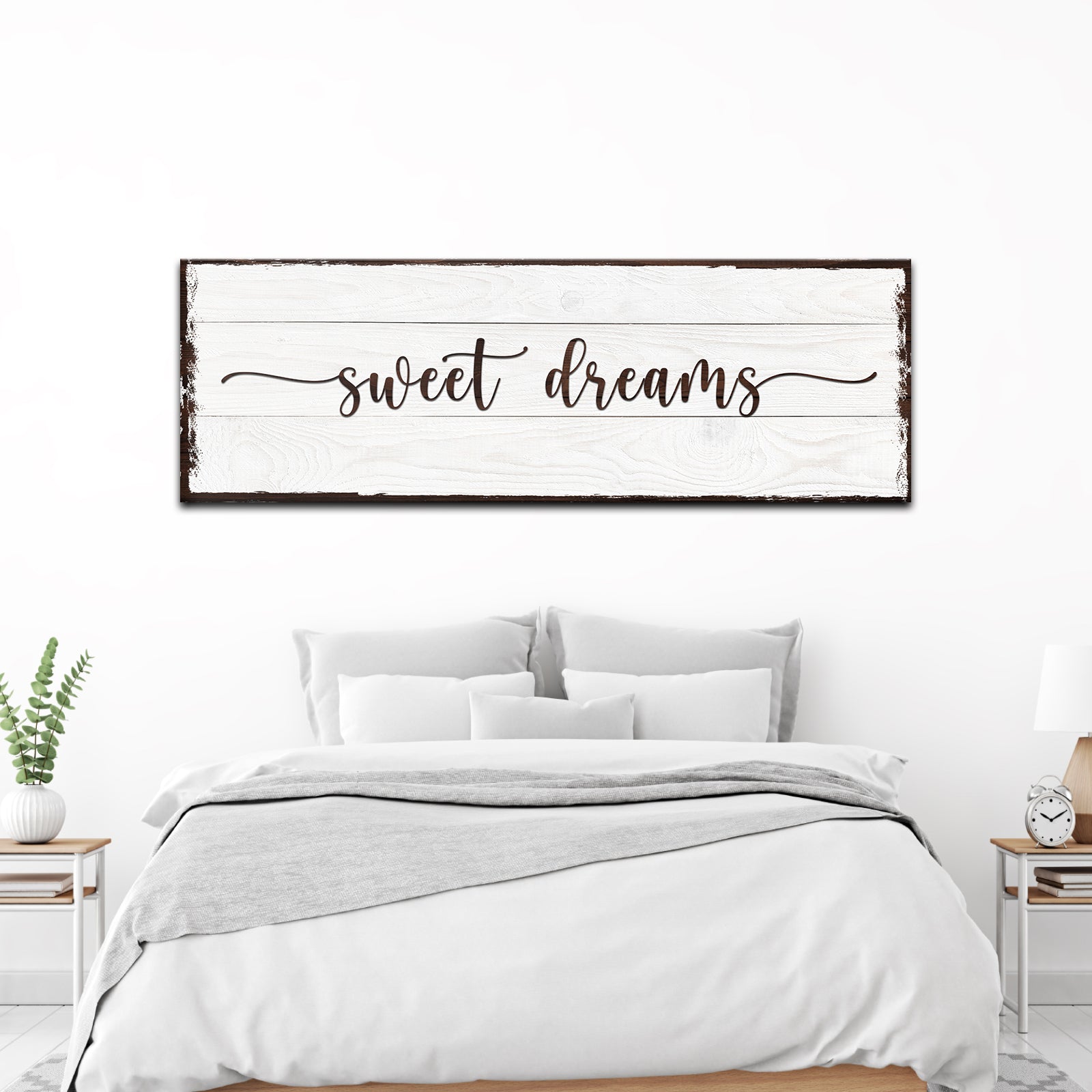 Bedroom with 'sweet dreams' sign above the bed