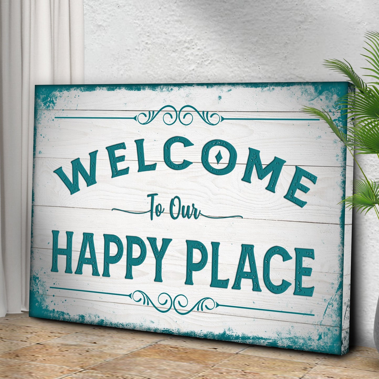 Decorative sign with 'Welcome to Our Happy Place' text on a wooden surface.