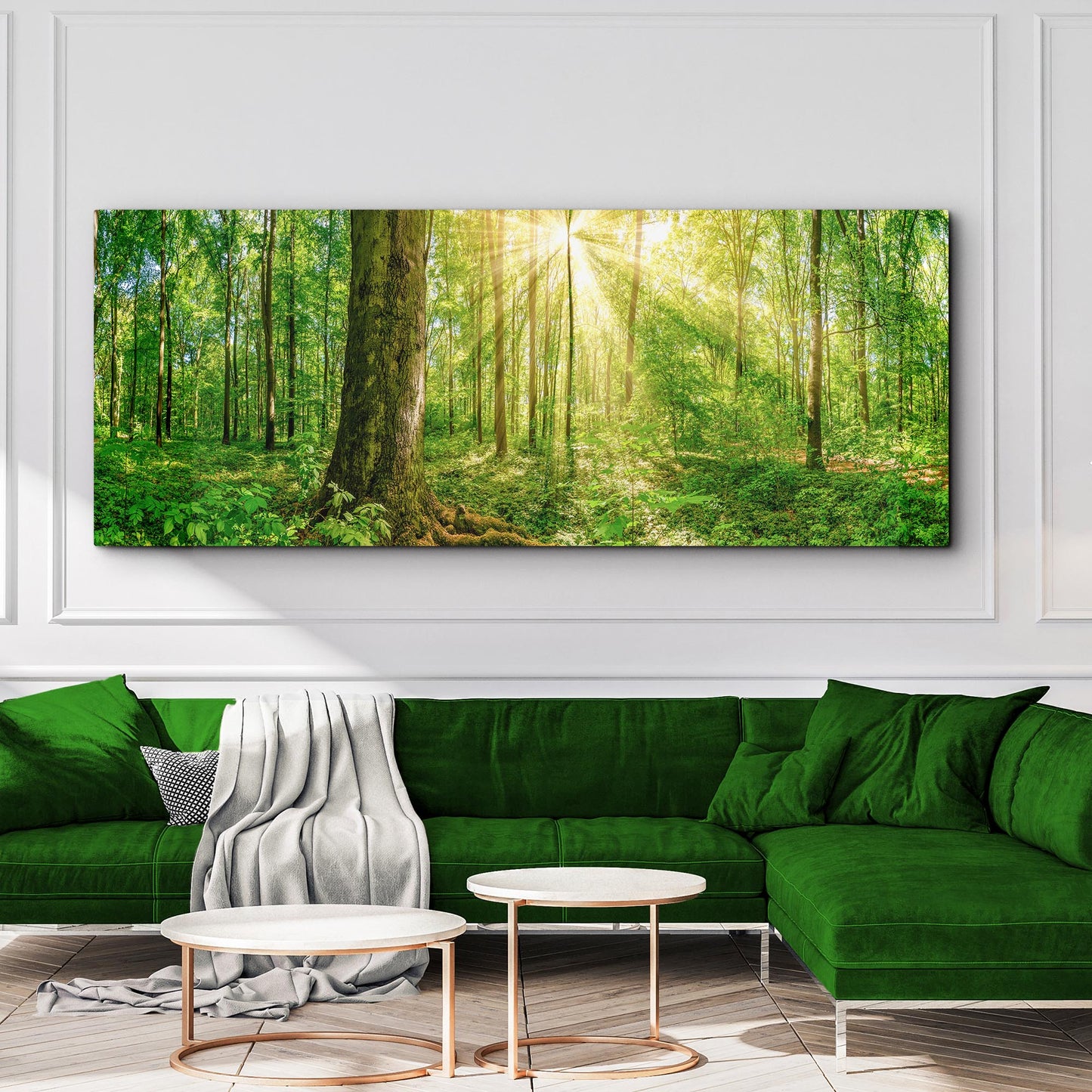 Panoramic forest scene painting above a green sofa in a living room.