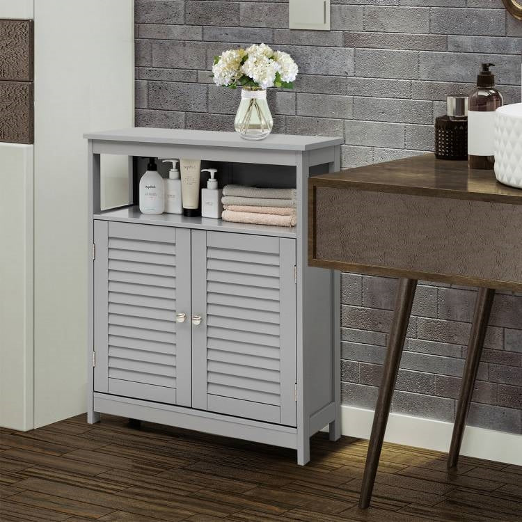 Gray cabinet with bathroom items against a tiled wall
