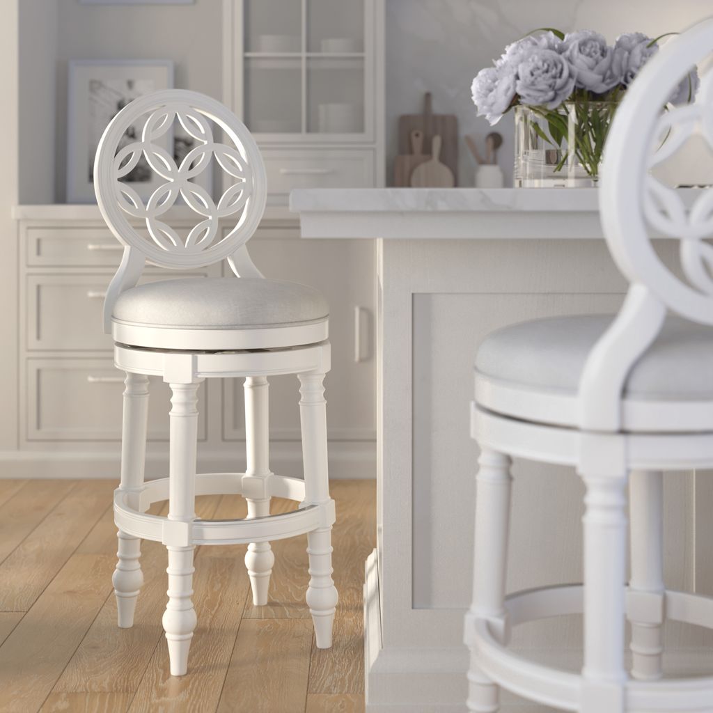 Gastonia Swivel Stool In White featured in a stylish kitchen setting with plush seating and intricate design.