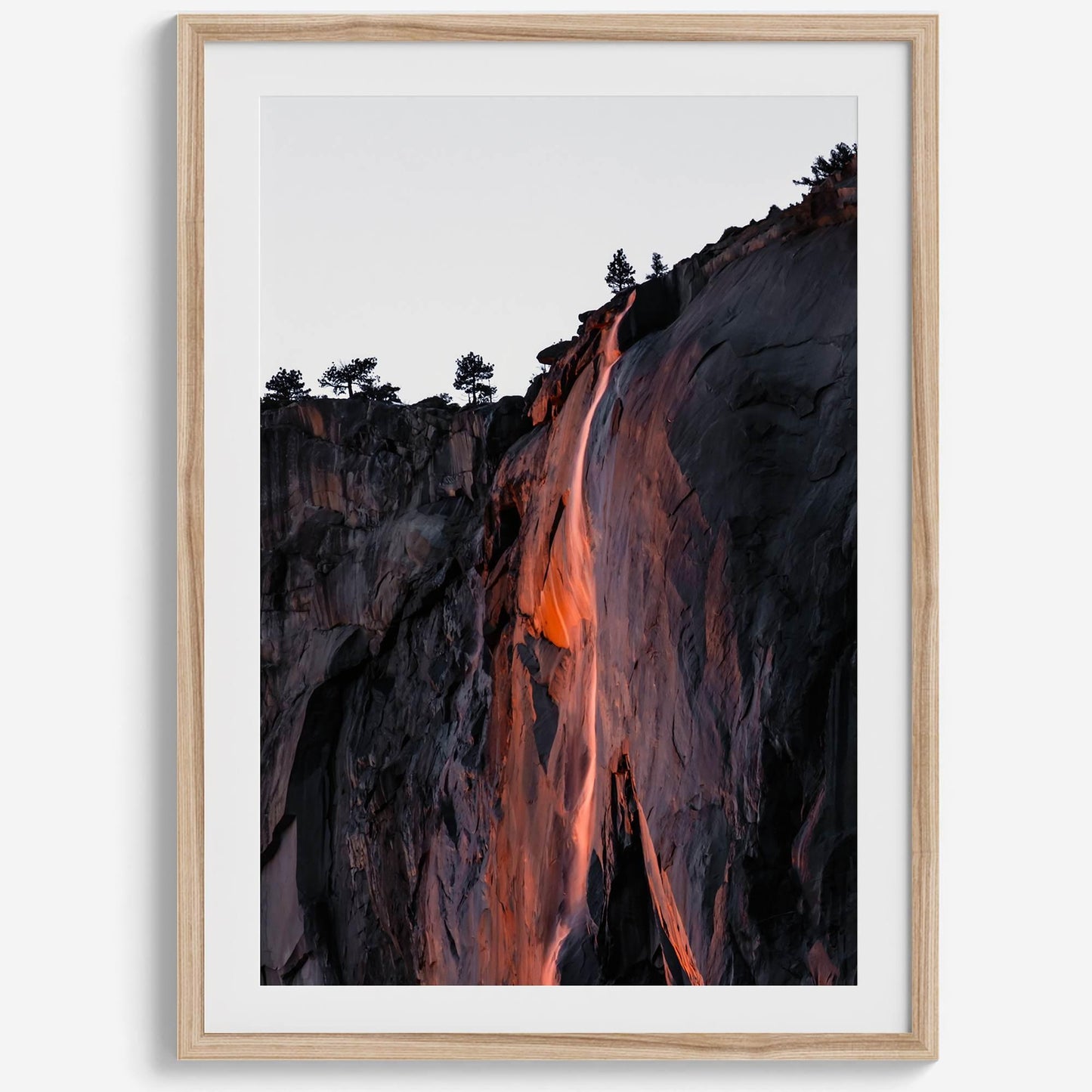 Framed print of the stunning Yosemite Firefall, Horsetail Falls glowing orange like fire in Yosemite National Park.