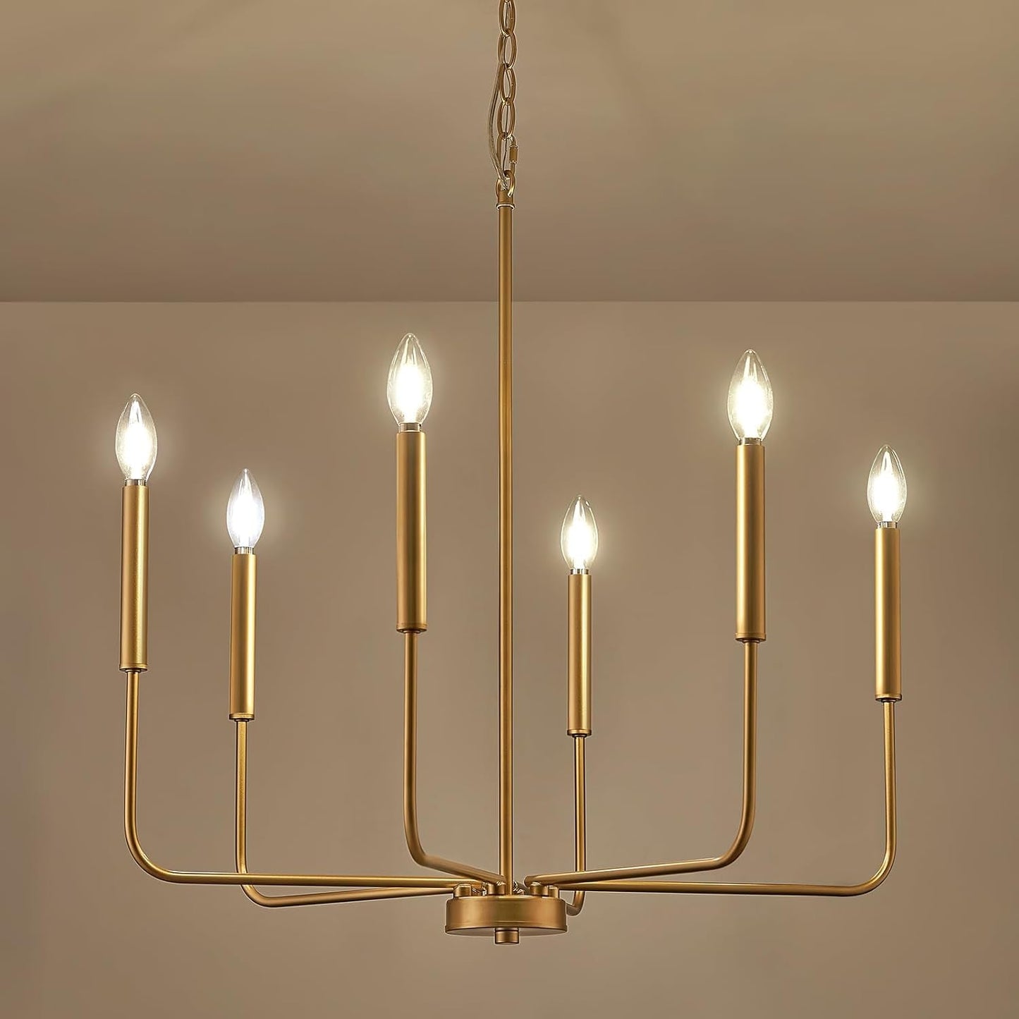 Gold 6 Light Candle Chandelier For Dining Room Modern with elegant arms and bright candle-like bulbs.