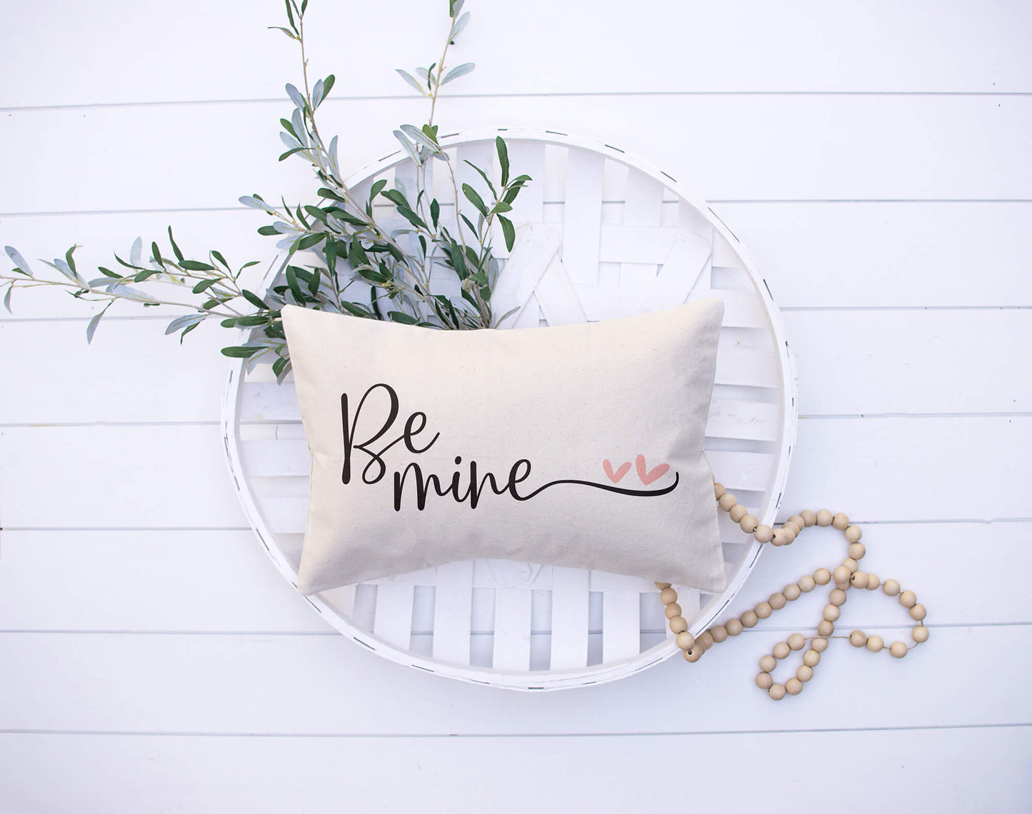 Be Mine Valentine's Day Pillow Cover styled with greenery on a round tray, perfect for Valentine's decor.