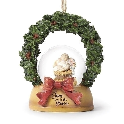Jesus Is The Reason Snowglobe Ornament featuring a baby Jesus figurine in a festive wreath design.