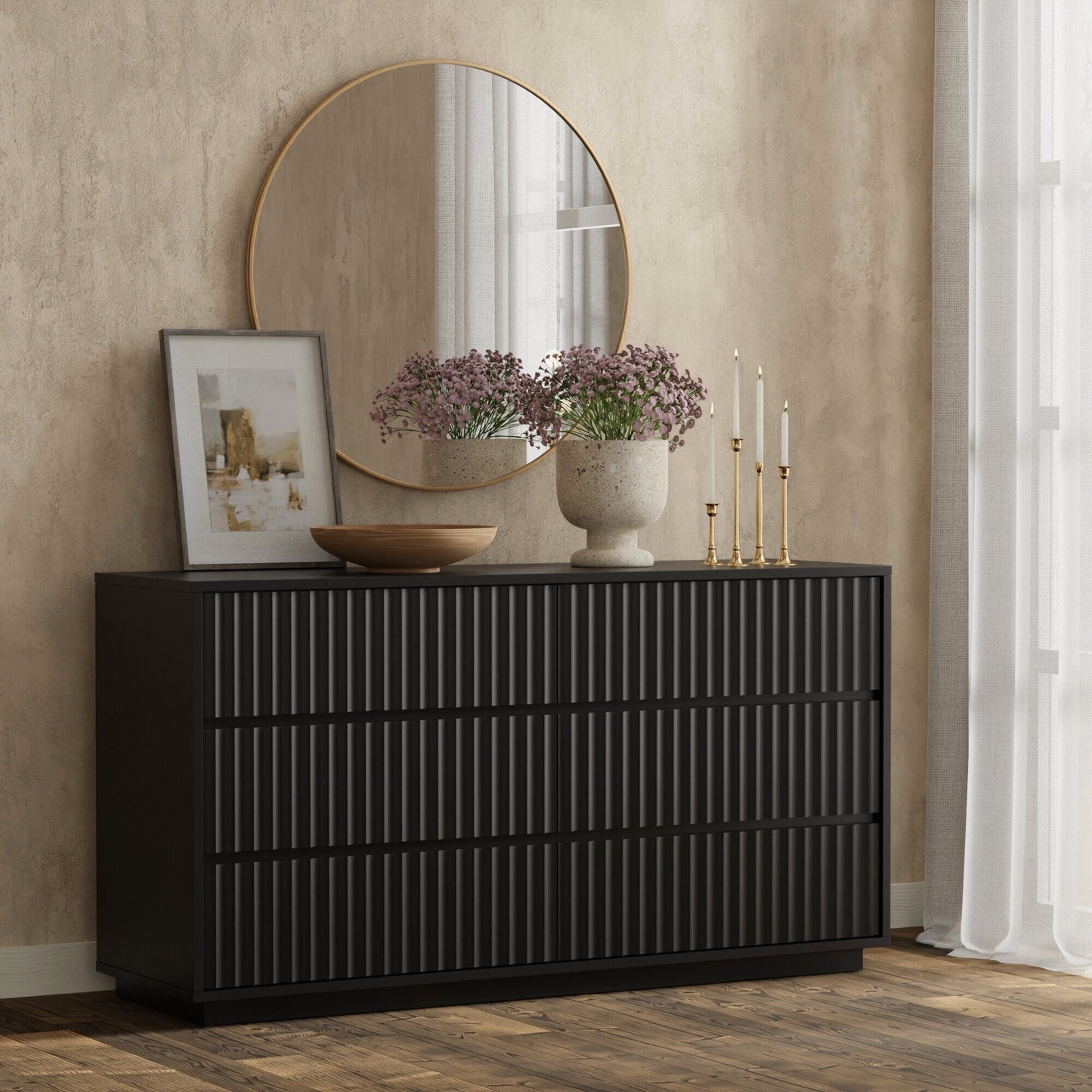 Blanca Dresser in black, featuring ribbed drawers, mirror, and decorative items in a stylish bedroom setting.