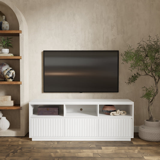 Blanca TV Console, White with TV on wall and decorative shelves in background.