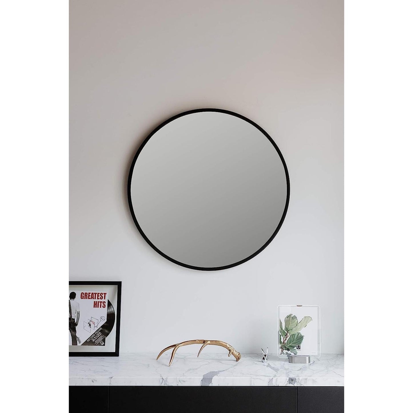 Round Rubber Wall Mirror 37 Inch diameter featuring a sleek design on a white wall.