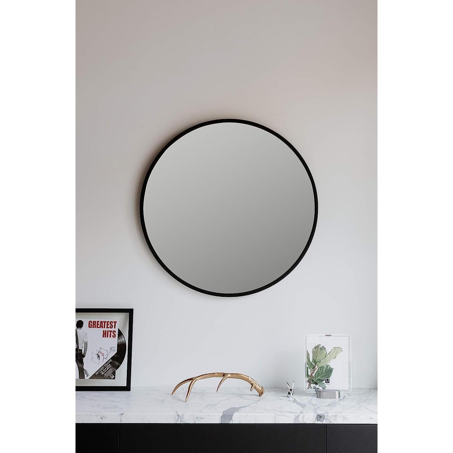 Round Rubber Wall Mirror 37 Inch diameter featuring a sleek design on a white wall.