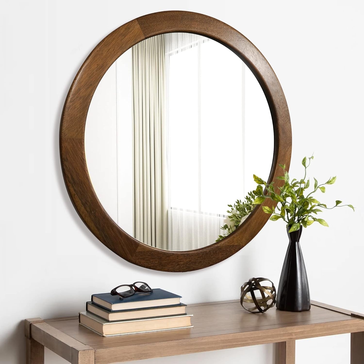 30 Inch Walnut Round Wall Mirror Rustic Style on a wooden table with decorative items.