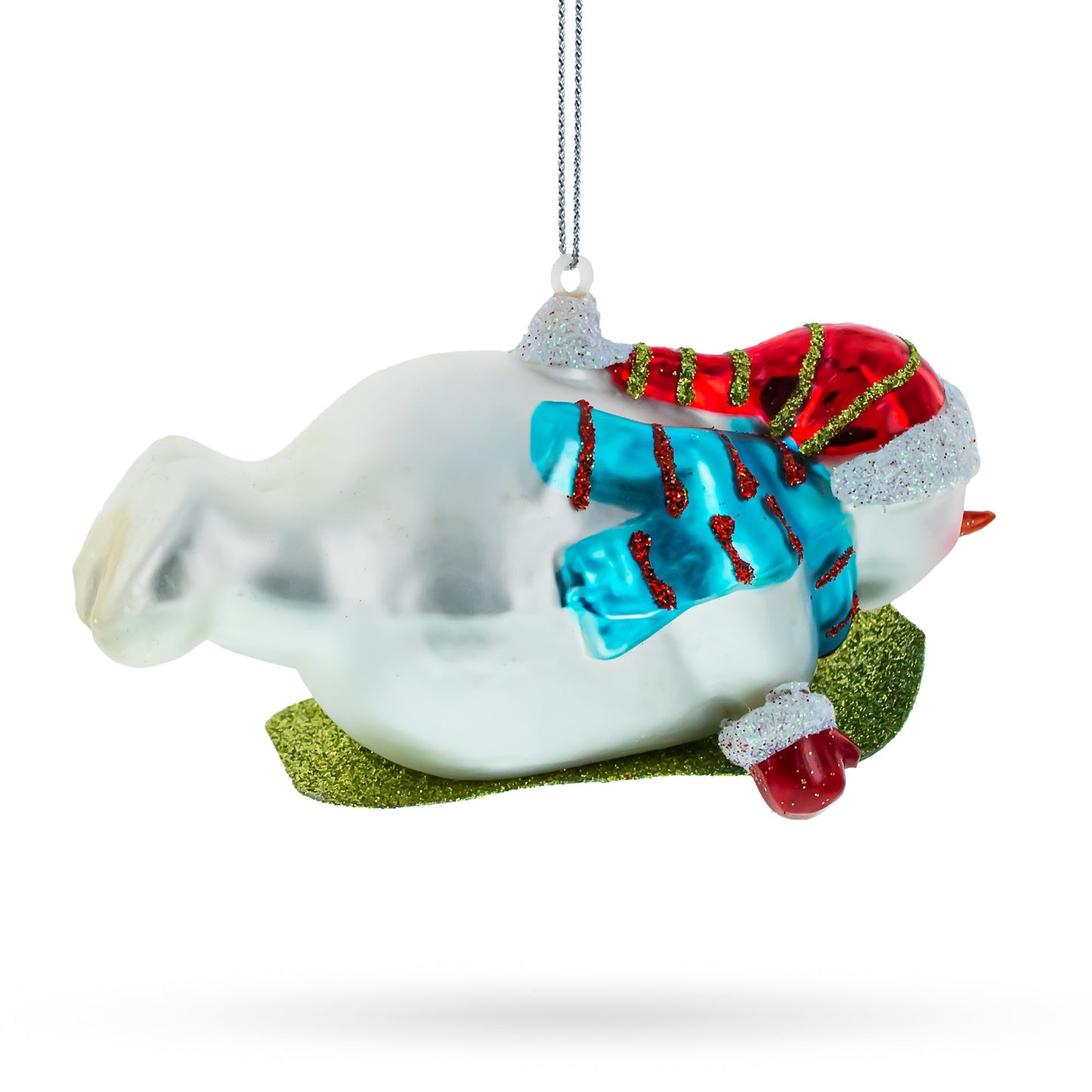 Snowman Gleefully Riding a Sled Glass Christmas Ornament