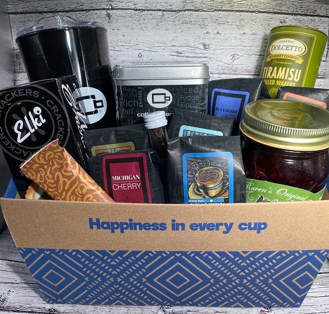 Gourmet Favorites Gift Basket filled with coffee, snacks, and treats for an indulgent experience.