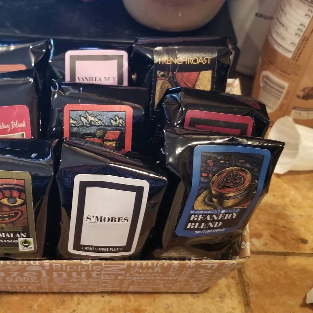 Indulgent Selection Gift Box showcasing various coffee sampler bags including S'mores and French Roast.