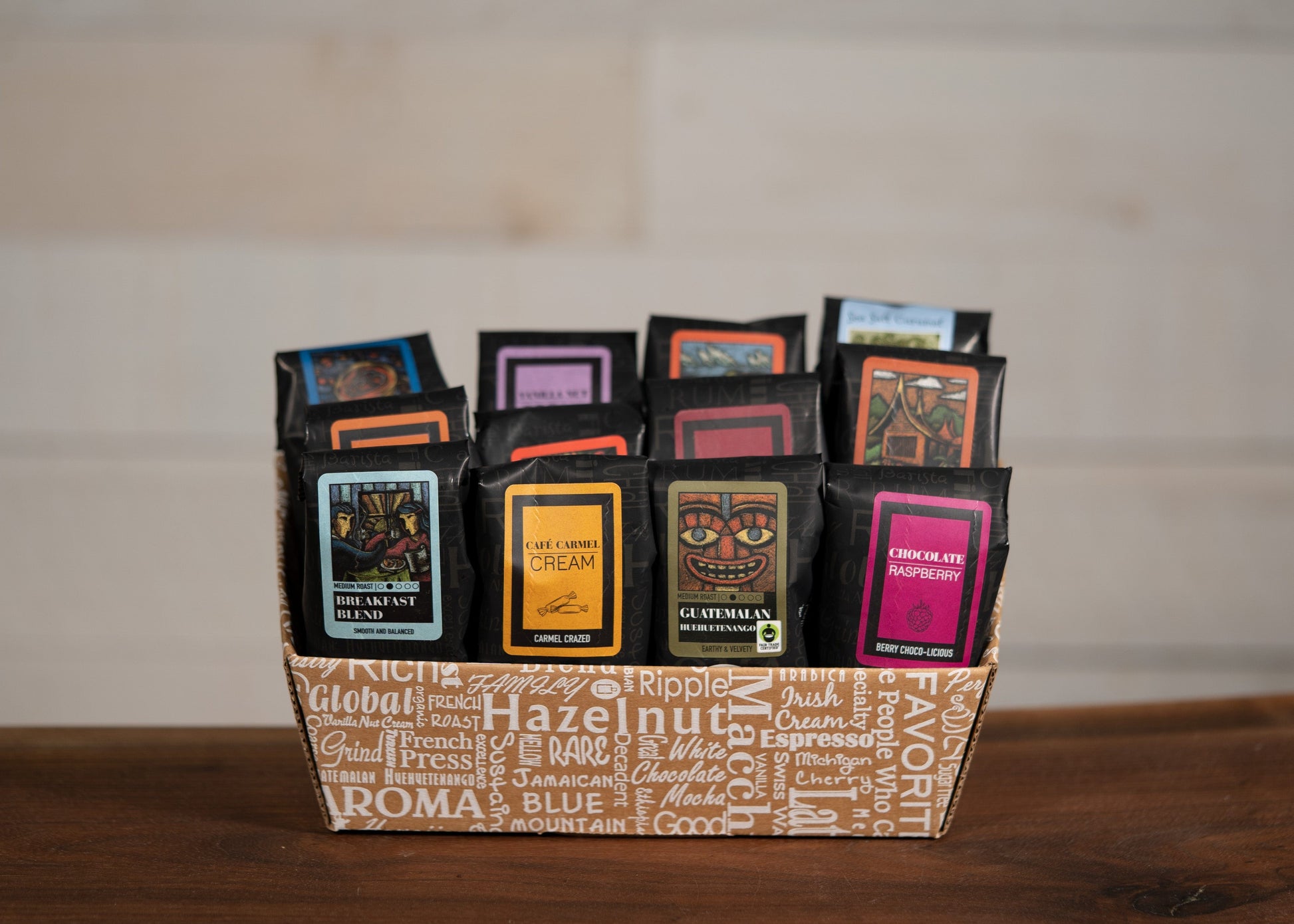 Indulgent Selection Gift Box featuring a variety of gourmet coffee samplers arranged in a decorative basket.