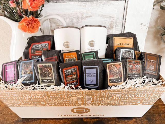 The VIP Coffee Gift Basket filled with various gourmet coffee packages and travel mugs.