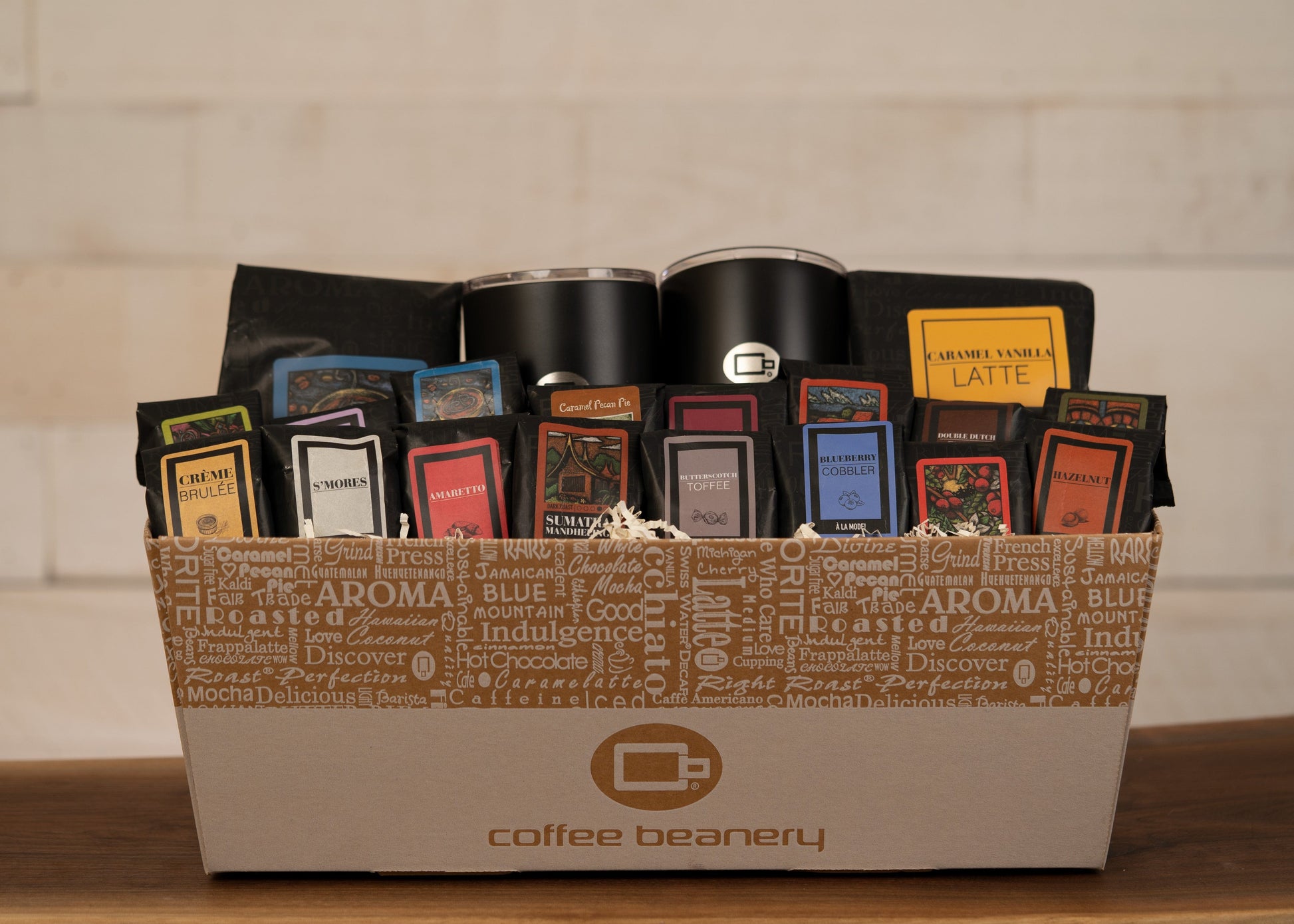 The VIP Coffee Gift Basket with gourmet coffee, travel mugs, and assorted flavored coffee packs.