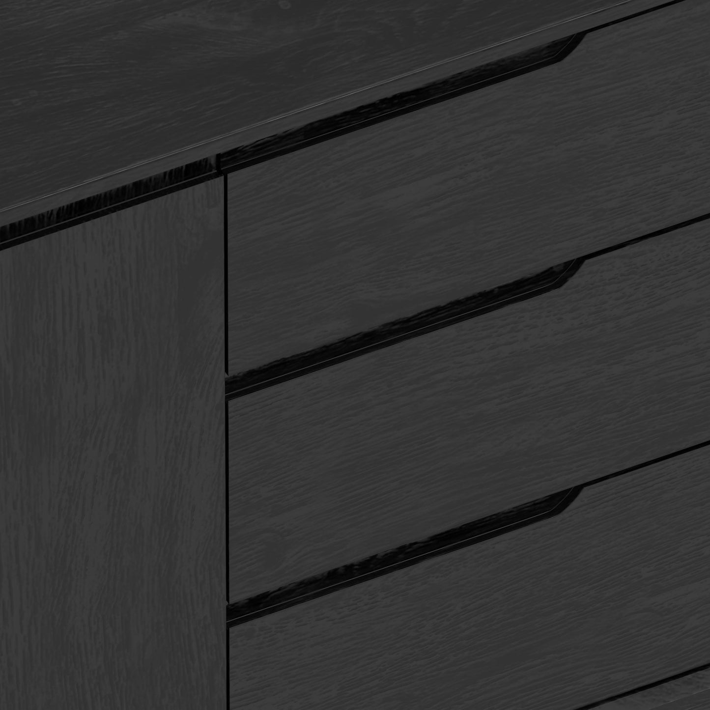 Close-up view of the Cove Sideboard in vintage black finish, showcasing its sleek design and storage drawers.