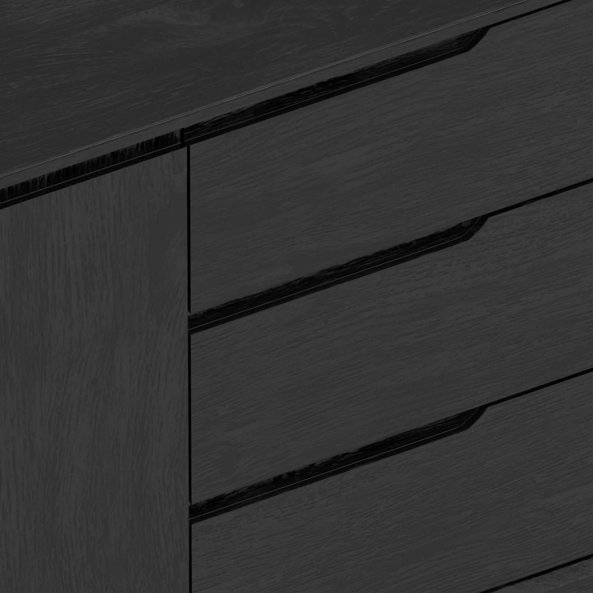 Close-up view of the Cove Sideboard in vintage black finish, showcasing its sleek design and storage drawers.