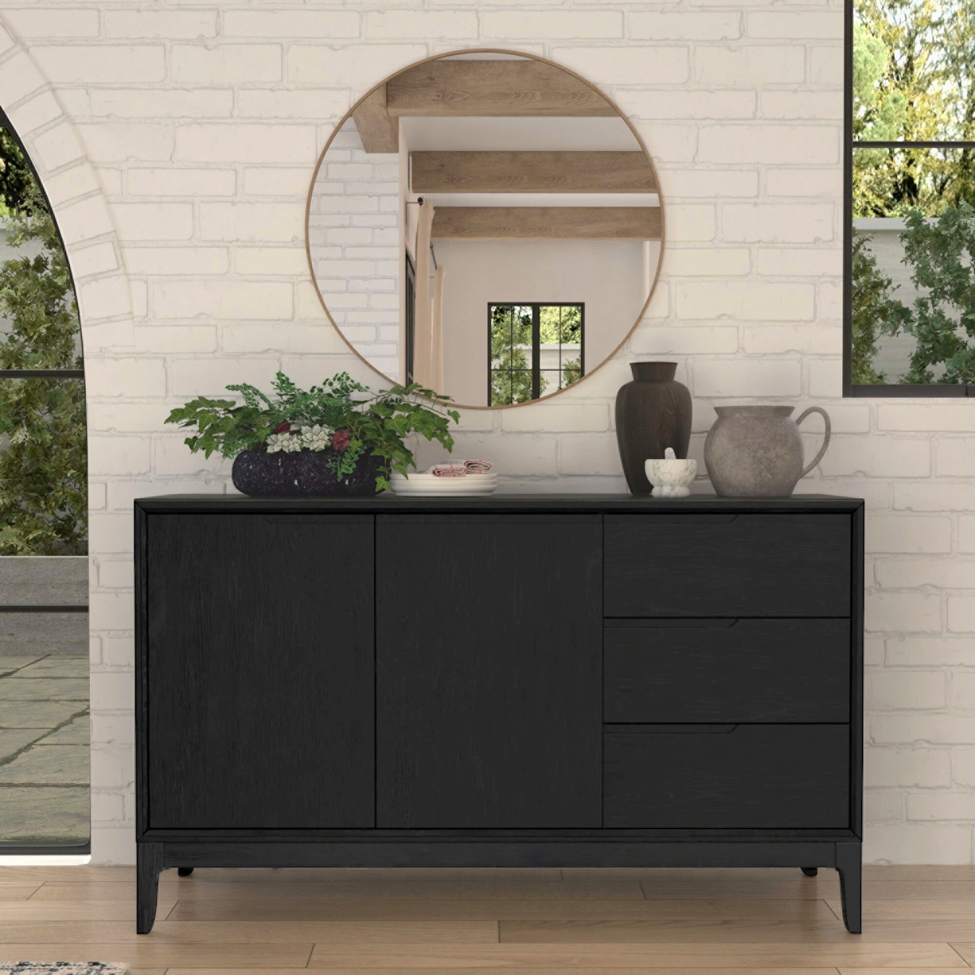 Cove Sideboard in vintage black finish, featuring three drawers and two cabinets, styled in modern living space.