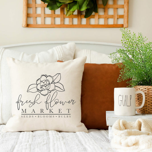 Fresh Flower Market Sketch Pillow Cover 18x18 inch on a cozy sofa with decorative elements.
