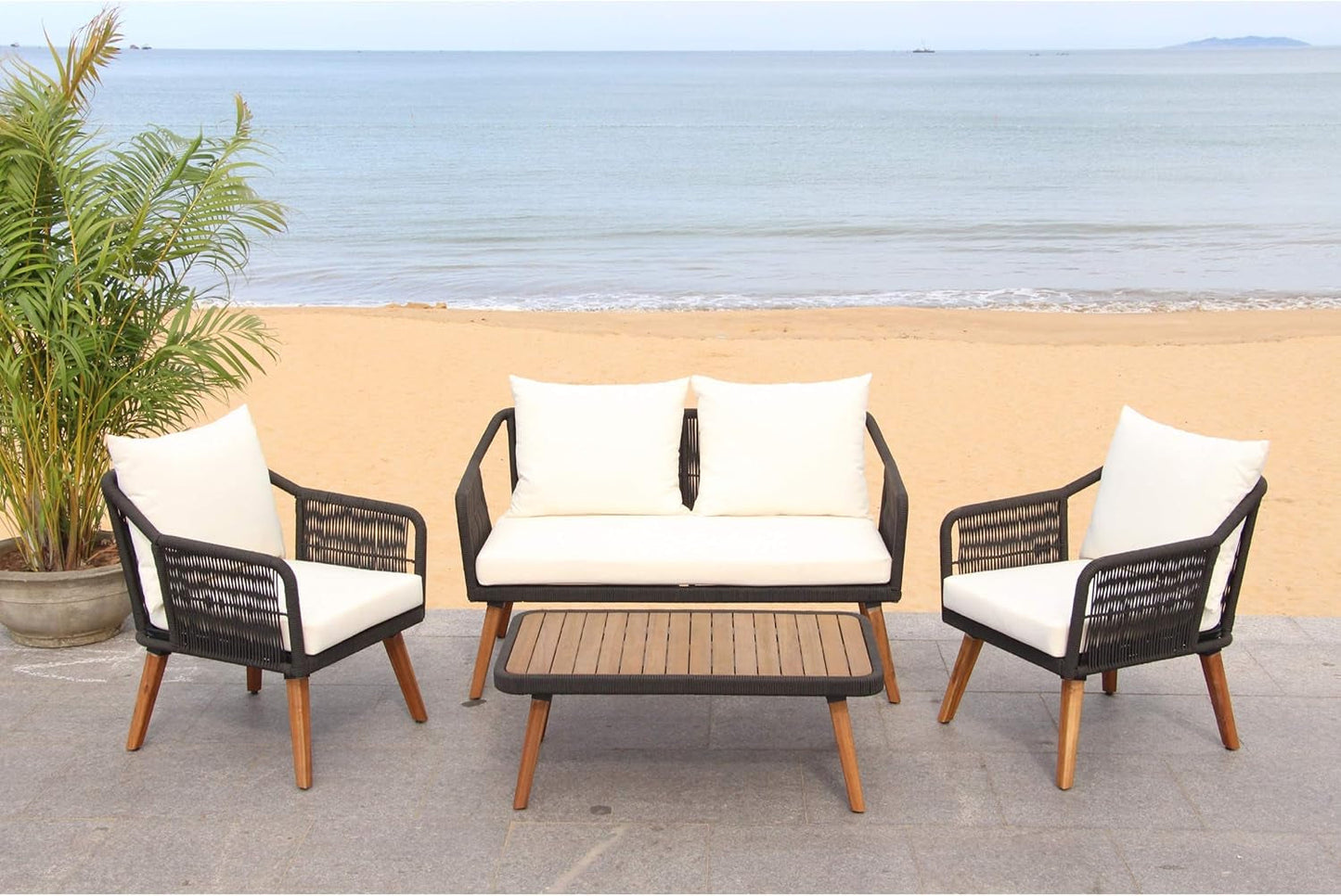 Outdoor Patio 4 Piece Eucalyptus Rope Furniture Set in a beachfront setting with plush cushions and a stylish design.