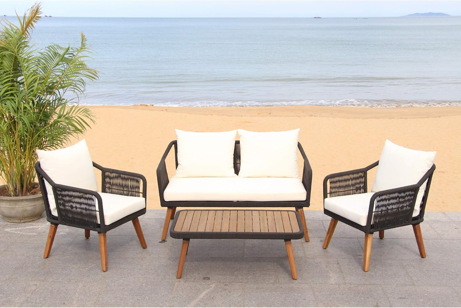 Outdoor Patio 4 Piece Eucalyptus Rope Furniture Set in a beachfront setting with plush cushions and a stylish design.