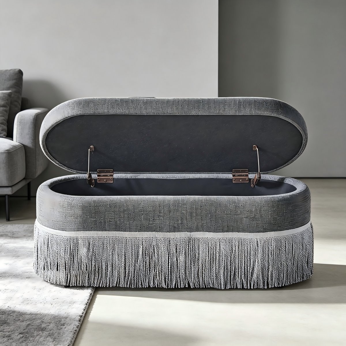 Oval Upholstered Storage Ottoman with Fringe Trim & Lift-Top Lid