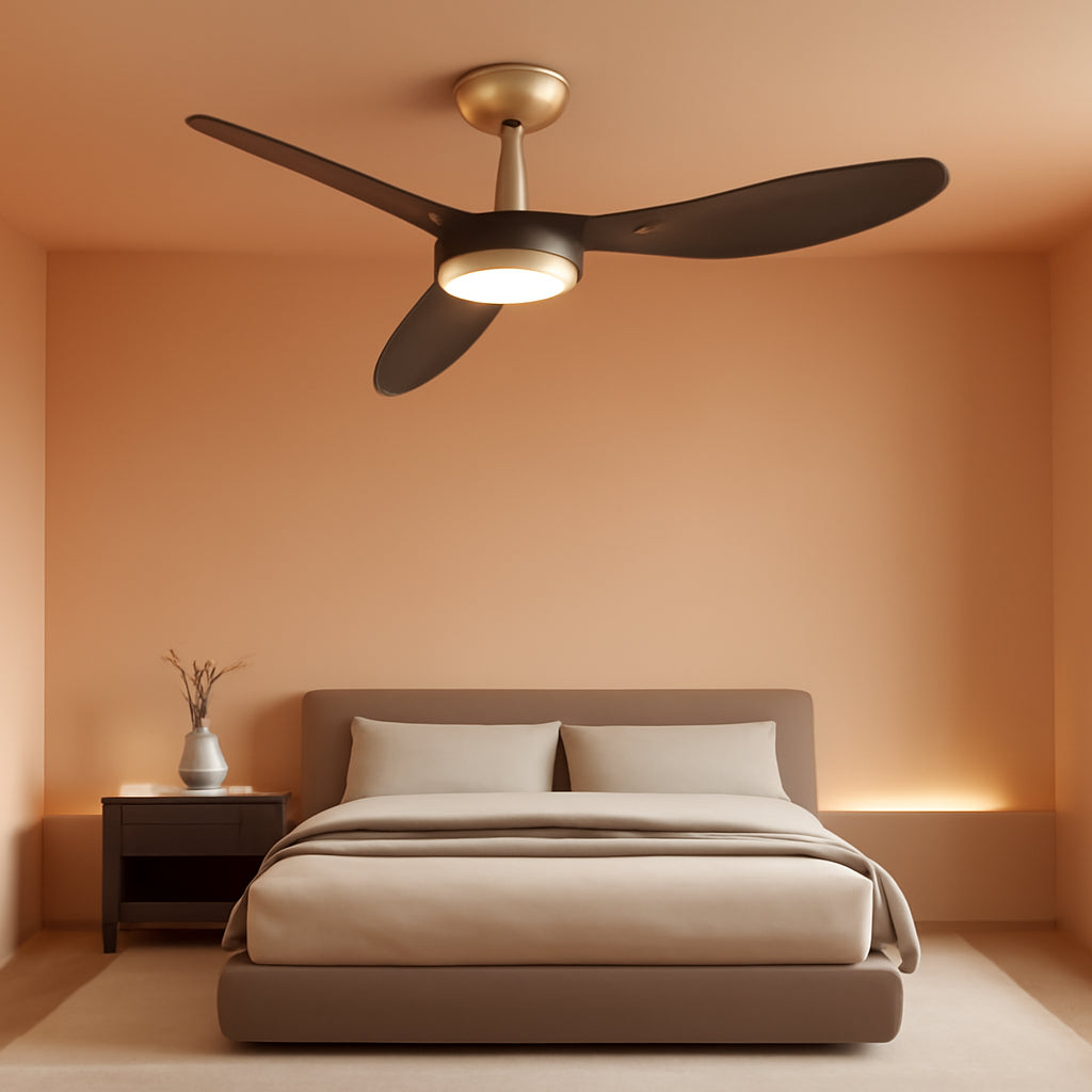 52 Inch Black Gold Indoor Ceiling Fan With LED Light illuminating a modern bedroom with a bed and side table.