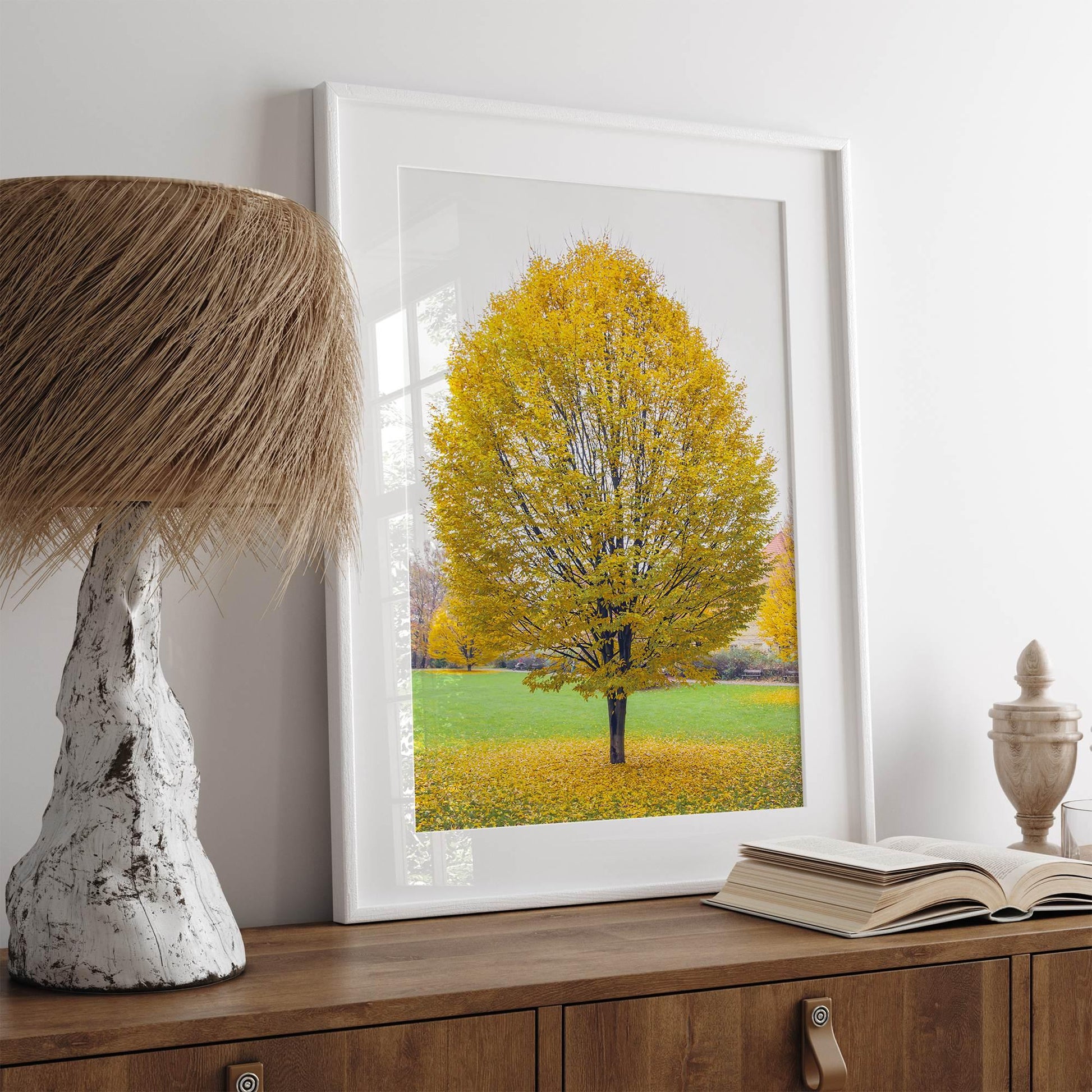 Golden Fall wall decor featuring a solitary tree with vibrant yellow leaves in a Prague park, bathed in autumn light.
