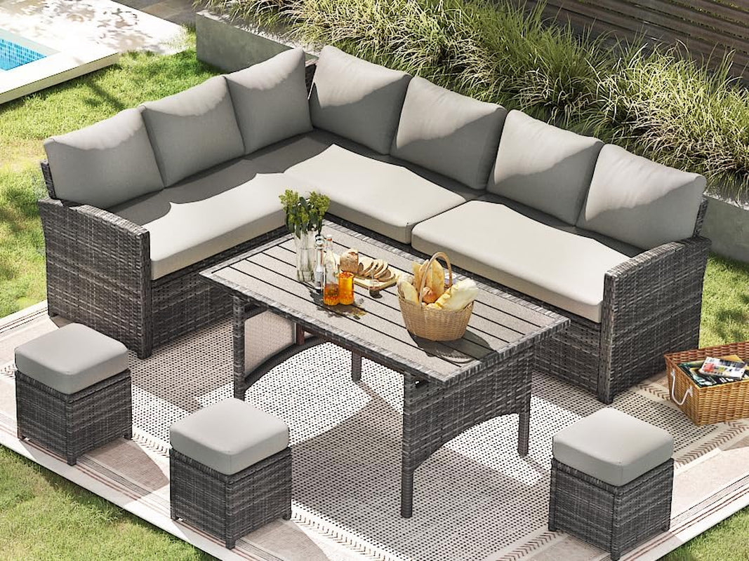 7 Piece Outdoor Patio Sectional Set All Weather Wicker Grey Cushions arranged in a stylish outdoor setting with a table.