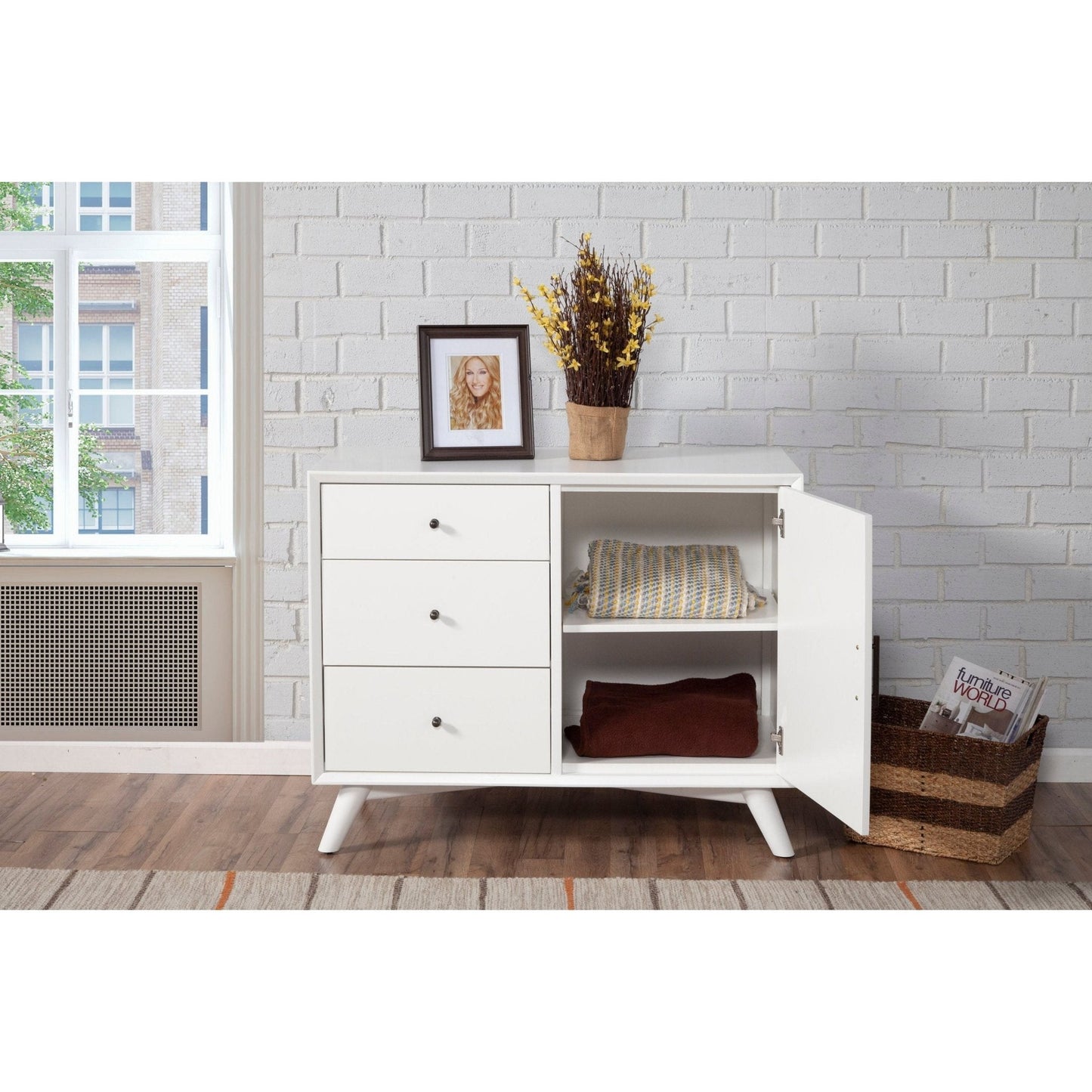 Flynn Accent Cabinet in white with three drawers and open shelving, styled in a modern living space.