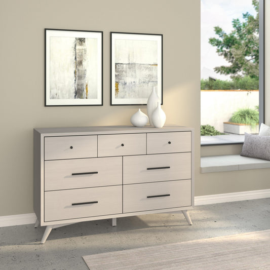 Flynn Dresser, Gray with seven drawers showcased in a modern interior setting.