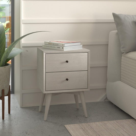 Flynn Nightstand in gray with two drawers beside a bed, featuring classic Mid-Century Modern design.