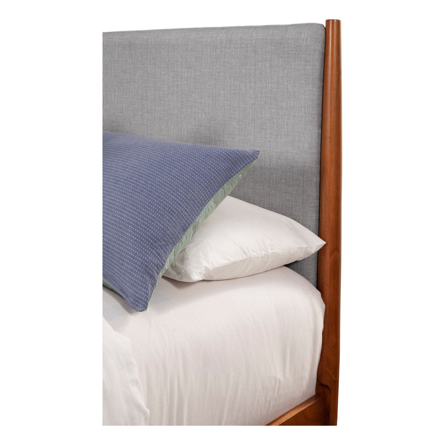 Flynn Panel Bed headboard in grey fabric with pillows on a bed, showcasing Mid-Century Modern design.
