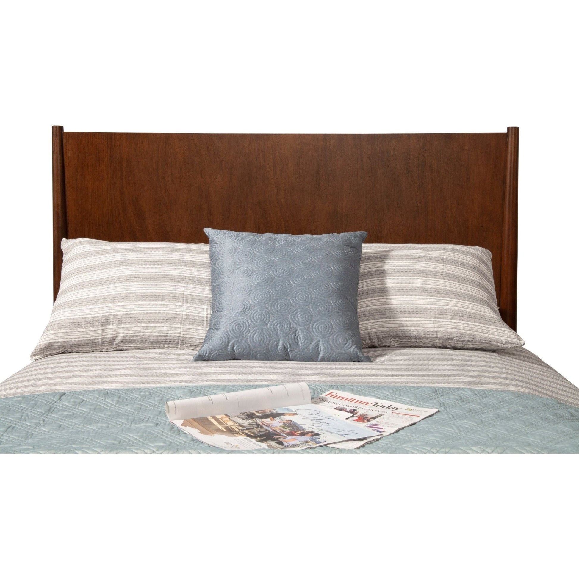 Flynn Panel Bed in walnut finish with stylish bedding and decorative pillow, perfect for a modern bedroom decor.