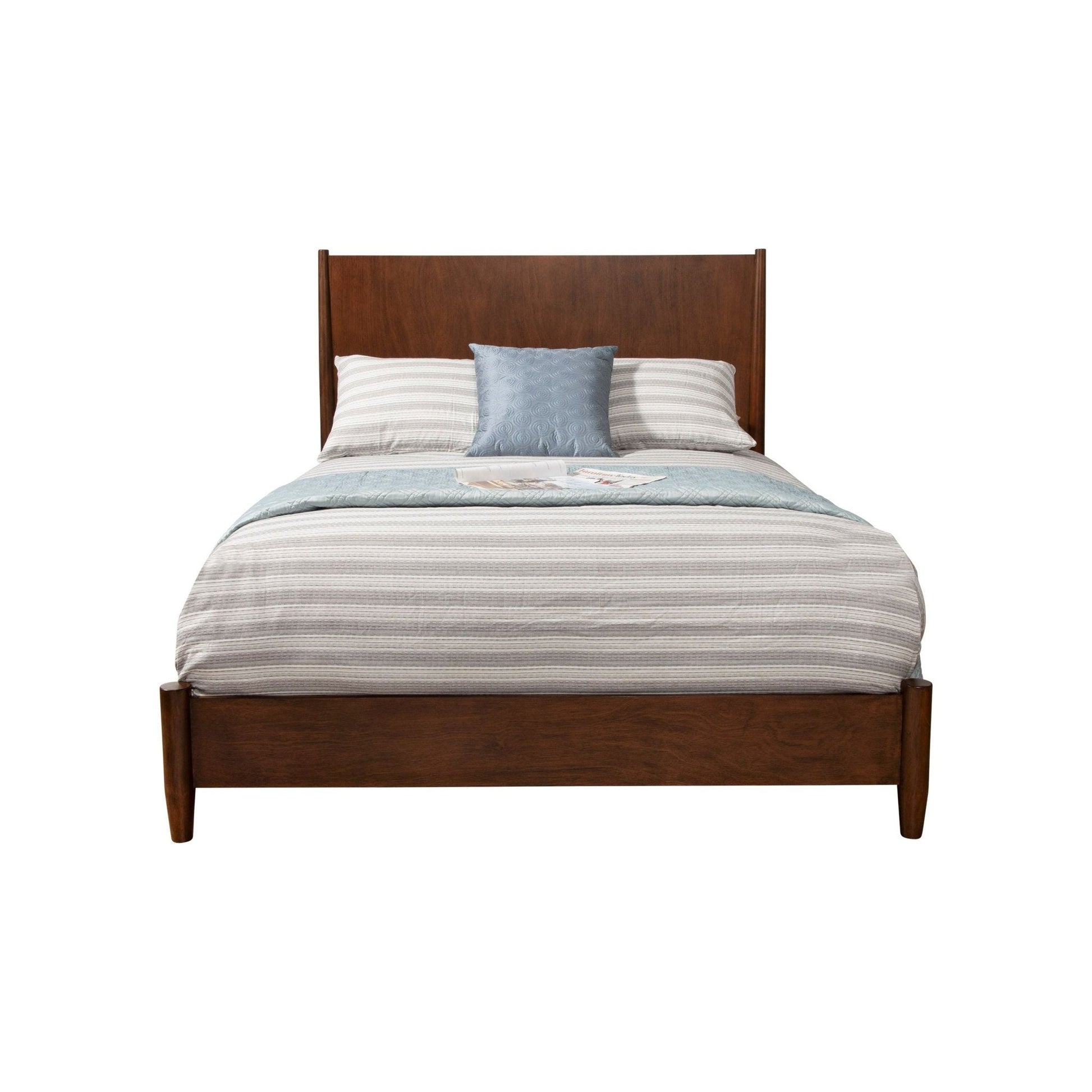 Flynn Panel Bed in Walnut featuring a modern design with a striped comforter and decorative pillows.