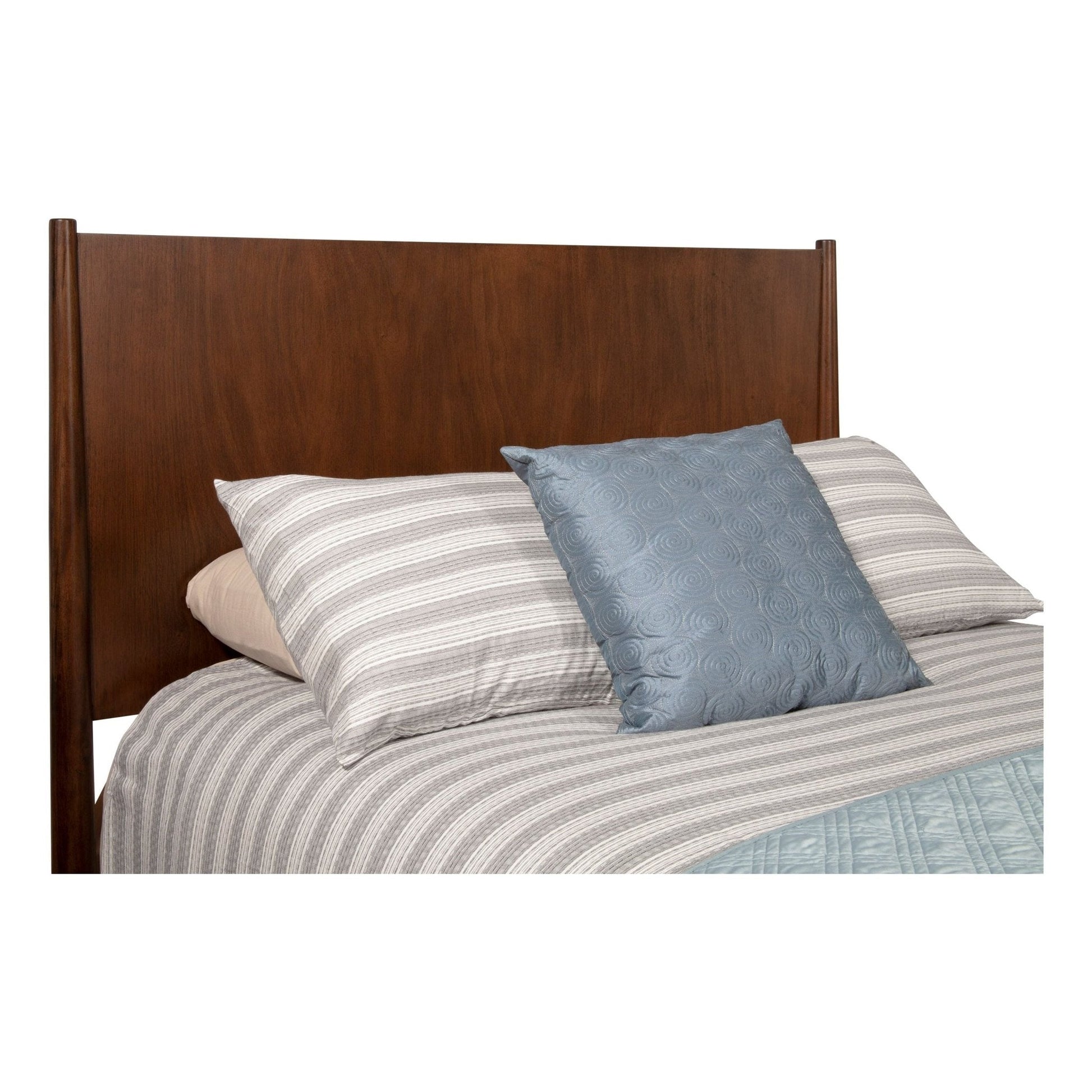Flynn Panel Bed in Walnut finish, showcasing the headboard and bedding with striped and solid pillows.