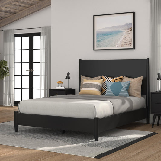 Flynn Platform Bed in black with gray bedding and decorative pillows in a stylish bedroom setting.